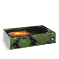 Gaming console skin with green circuit board design on a white background