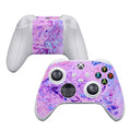 Gaming controller with a purple and pink marbled skin on a white background