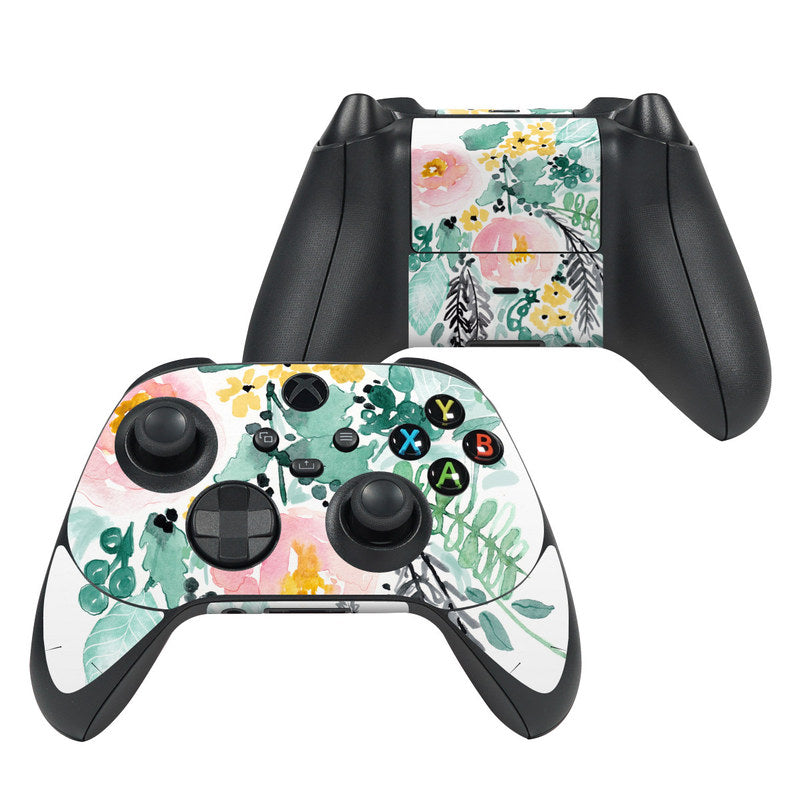 Gaming controller with floral design on a white background