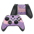 Gaming controller with a purple and pink design on a white background