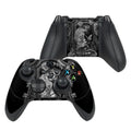 Black gaming controller with intricate design on a white background